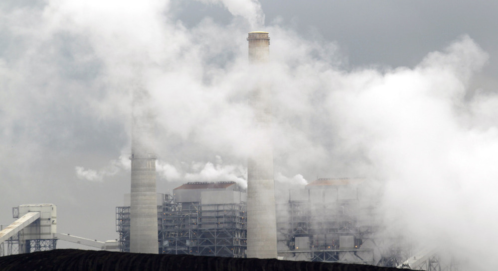 Piles of coal are shown at NRG Energy's W.A. Parish Electric Generating Station in Thompsons, Texas. The U.S. Environmental Protection Agency will begin regulating mercury emissions from coal-fired power plants for the first time.