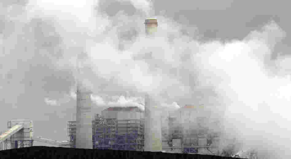 Piles of coal are shown at NRG Energy's W.A. Parish Electric Generating Station in Thompsons, Texas. The U.S. Environmental Protection Agency will begin regulating mercury emissions from coal-fired power plants for the first time.