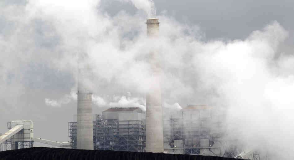 Piles of coal are shown at NRG Energy's W.A. Parish Electric Generating Station in Thompsons, Texas. The U.S. Environmental Protection Agency will begin regulating mercury emissions from coal-fired power plants for the first time.
