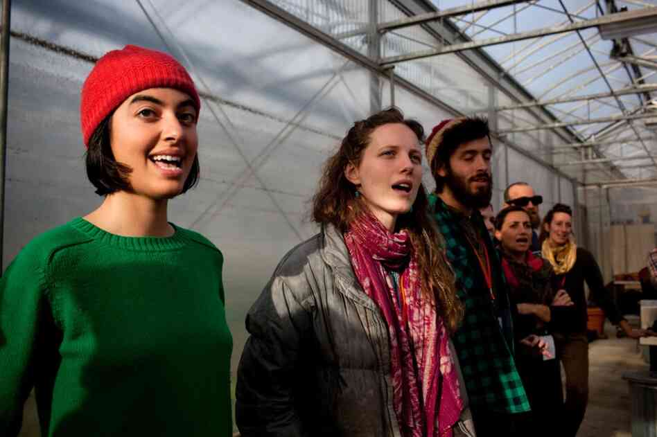 From left: Mitra Sticklen, Rachel Fleury and Nate Kraus-Malett learn traditional farming work songs.