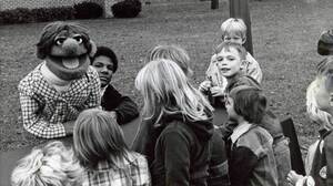Kevin Clash (center) started making puppets when he was a teenager in Baltimore.