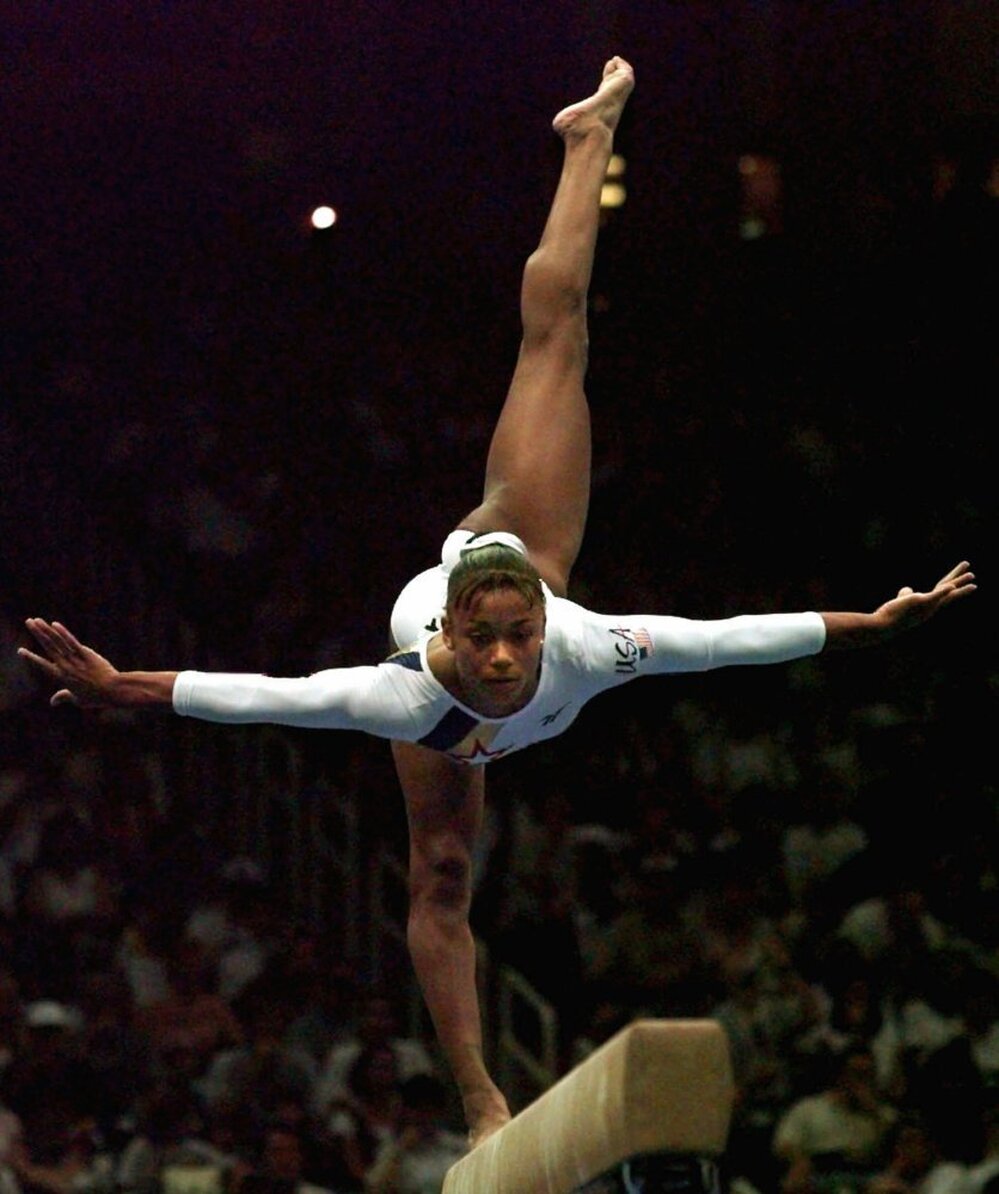 Dawes performs her balance beam routine at the Atlanta Games in 1996.