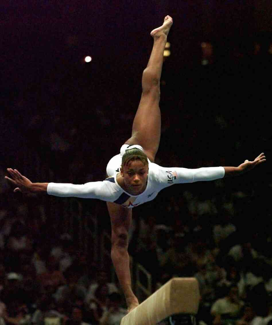 Dawes performs her balance beam routine at the Atlanta Games in 1996.
