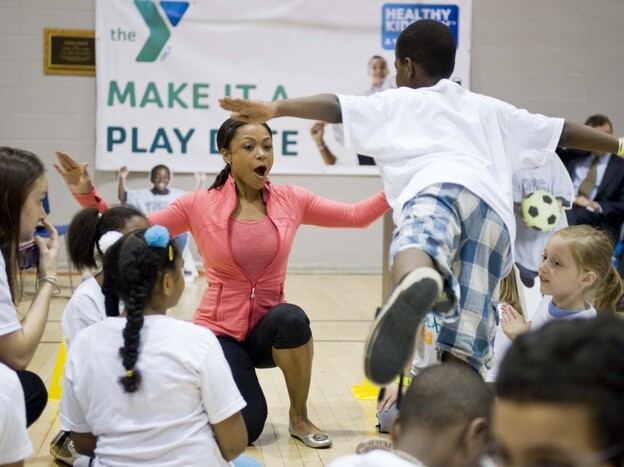 Dominique Dawes encourages kids to get 60 minutes of active play every day as part of the kick off of YMCA's Healthy Kids Day in April 2011.