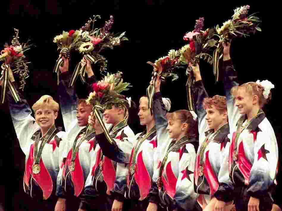 Dawes and her teammates, known as the "Magnificent Seven," wave to the crowd after being awarded their gold medals in the team competition at the 1996 Summer Games in Atlanta.