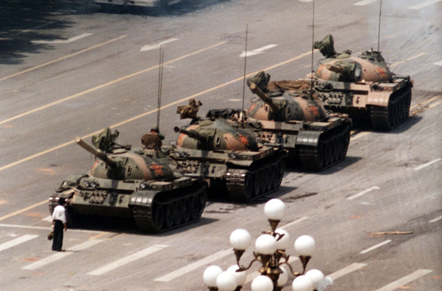 A Chinese protestor blocks a line of tanks June 5, 1989. The man, calling for an end to the violence and bloodshed against pro-democracy demonstrators at Tiananmen Square.