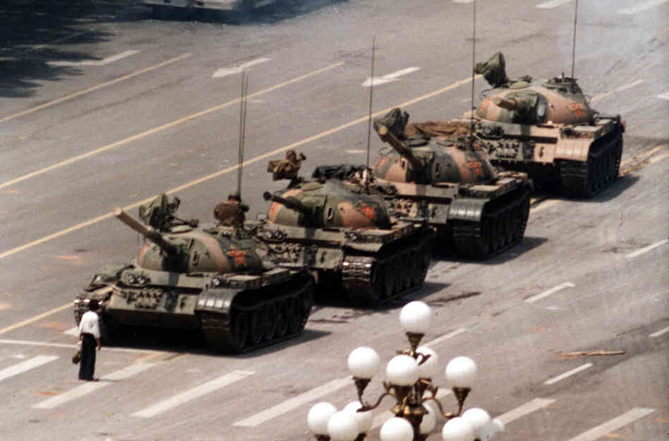 A Chinese protestor blocks a line of tanks June 5, 1989. The man, calling for an end to the violence and bloodshed against pro-democracy demonstrators at Tiananmen Square.