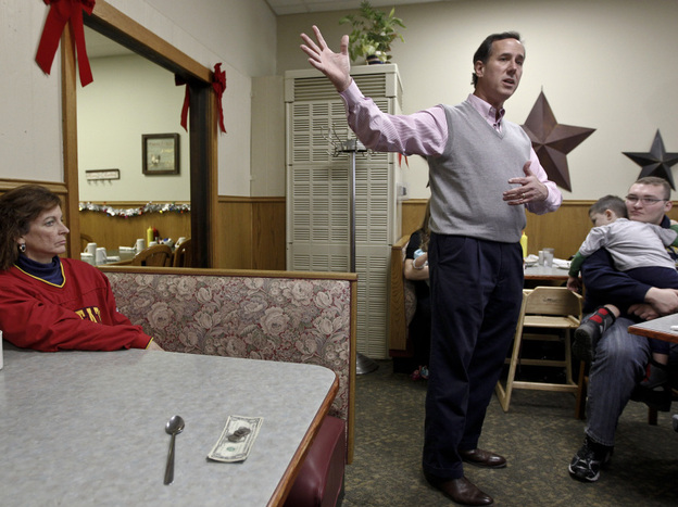 Former Pennsylvania Sen. Rick Santorum speaks Tuesday at the Lincoln Cafe in Belle Plaine, Iowa. Among GOP candidates, Santorum had the state to himself on Tuesday.