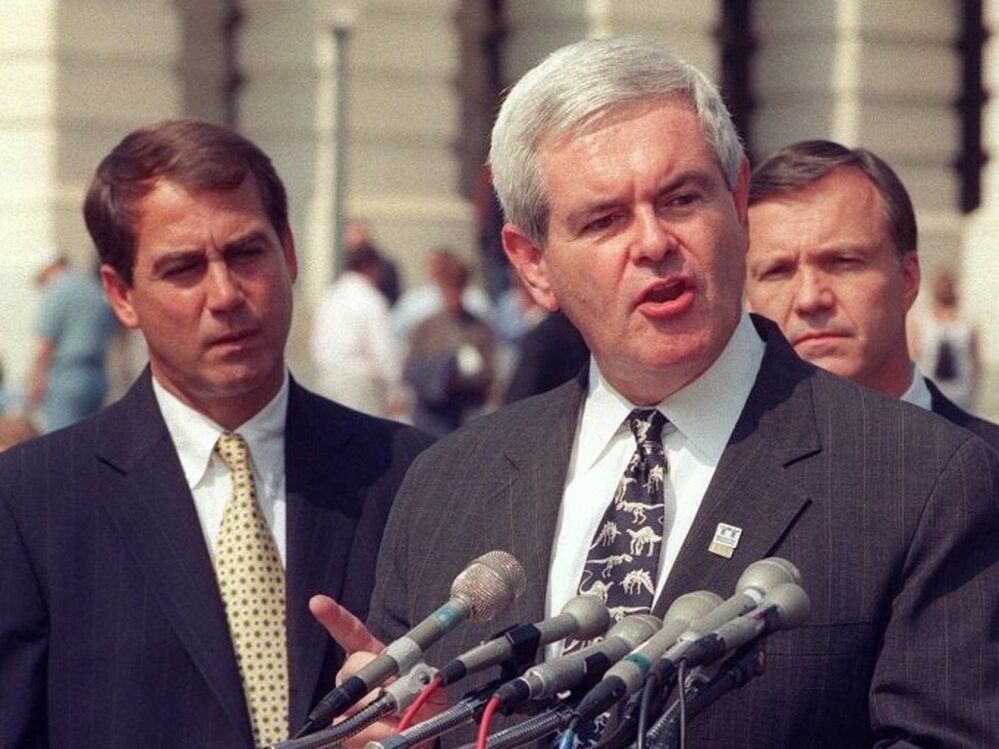 Then-House Speaker Newt Gingrich at a 1998 Capitol Hill news conference, flanked by Ohio Republican Rep. John Boehner, left (the current House speaker), and California Republican Rep. Christopher Cox.