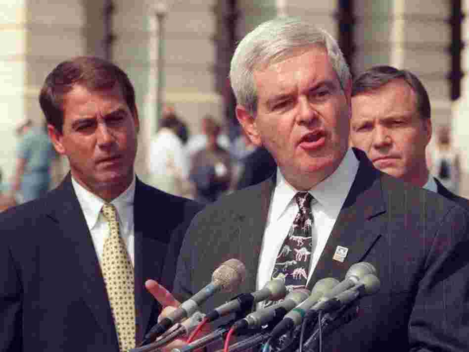 Then-House Speaker Newt Gingrich at a 1998 Capitol Hill news conference, flanked by Ohio Republican Rep. John Boehner, left (the current House speaker), and California Republican Rep. Christopher Cox.