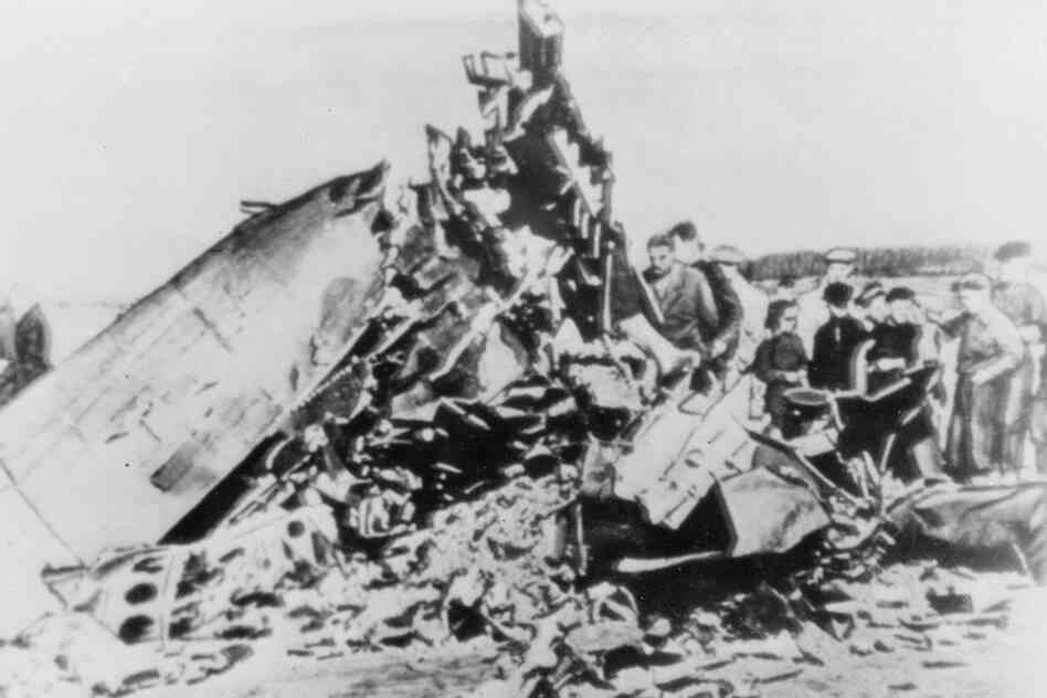 People inspect the remains of the U-2 spy plane flown by American pilot Francis Gary Powers, which was shot down over Soviet airspace on Aug. 6, 1960. 
