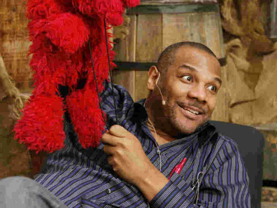 Elmo and Clash, on the Sesame Street set in 2006.