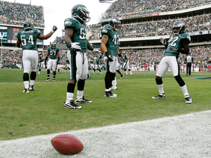End Zone Dance: Asante Samuel (22, right) celebrates a touchdown after making an interception, as his Philadelphia Eagles teammates seem to wait for cues to the next dance steps, Nov. 13. End Zone Dance: Asante Samuel (22, right) celebrates a touchdown after making an interception, as his Philadelphia Eagles teammates seem to wait for cues to the next dance steps, Nov. 13.