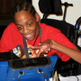  Tres Whitlock types on the DynaVox tablet that serves as his voice. Whitlock, 17, has cerebral palsy and can't speak on his own. He is trying to enroll in a Hillsborough County charter school, but has yet to enroll because of concerns about the therapy and services he needs. 