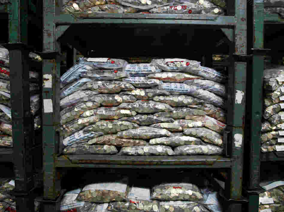Dollar coins gathering dust in the Fed's Baltimore brach. Dollar coins gathering dust in the Fed's Baltimore brach.