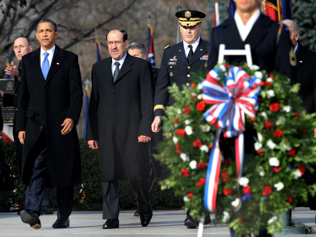 President Obama and Iraqi Prime Minister Nouri al-Maliki (second from left) participate in a wreath-laying ceremony at Arlington National Cemetery on Monday. Maliki was in Washington for talks ahead of the full withdrawal of U.S. troops from Iraq this month.