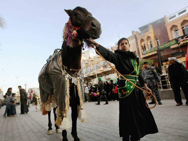 Iraqi Shiite Muslims march in a parade on Dec. 1 in Baghdad. As U.S. troops prepare to leave, the security situation in some parts of the country remains uncertain.