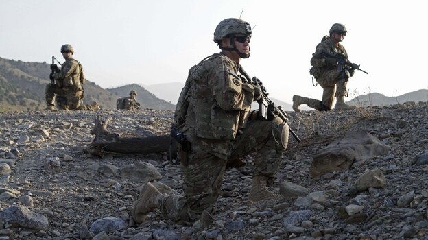Staff Sgt. Joshua White (center), Command Sgt. Maj. John Troxell (left) and Brigade Sgt. Maj. Mike Boom (right) observe a joint patrol of U.S. Army and Afghan National Army soldiers and Afghan police in Paktika province, Afghanistan, on Oct. 3. The mountainous border between Afghanistan and Pakistan has become a new front line in the Afghan war. Staff Sgt. Joshua White (center), Command Sgt. Maj. John Troxell (left) and Brigade Sgt. Maj. Mike Boom (right) observe a joint patrol of U.S. Army and Afghan National Army soldiers and Afghan police in Paktika province, Afghanistan, on Oct. 3. The mountainous border between Afghanistan and Pakistan has become a new front line in the Afghan war.