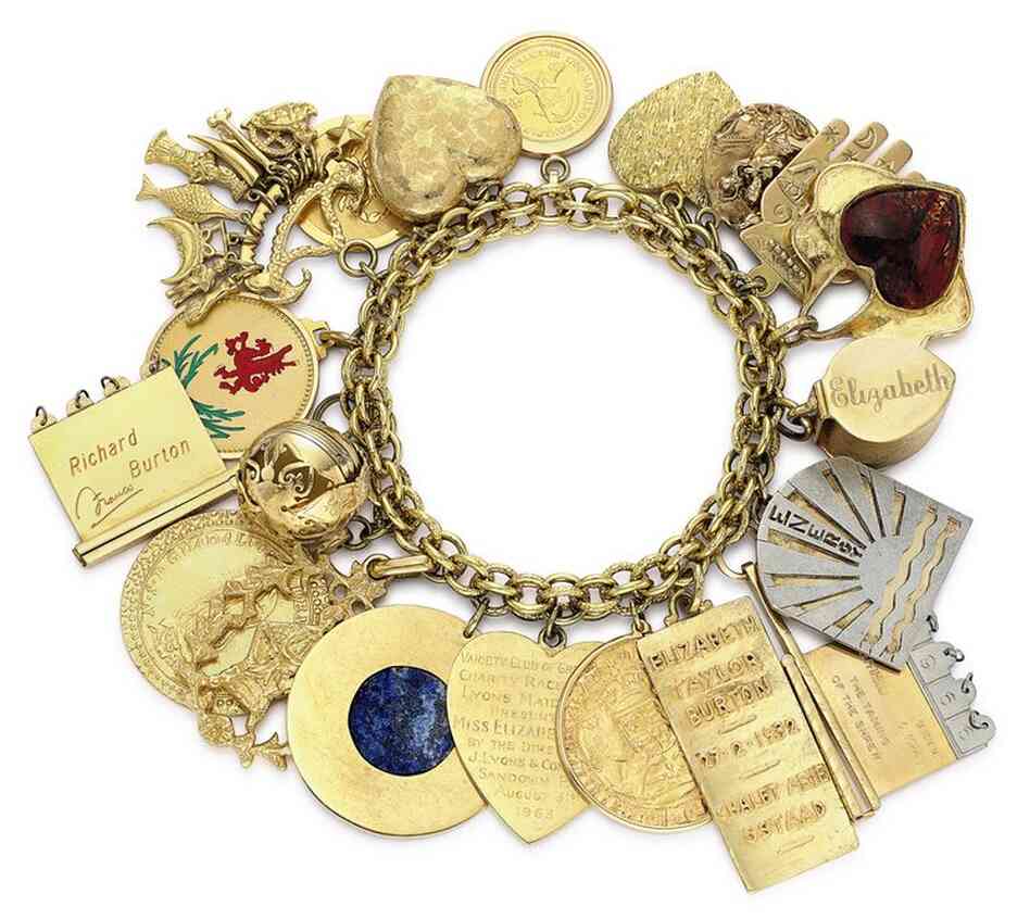 Burton also gave Taylor this charm bracelet, estimated to be worth between $25,000 and 35,000. Among the 20 charms is a locket that opens to reveal four medallions, each engraved with the names and birthdates of Taylor's four children.