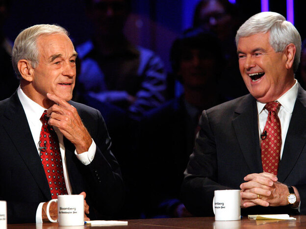 Republican presidential candidates Ron Paul and Newt Gingrich laugh at a presidential debate at Dartmouth College in Hanover, N.H., in October. 