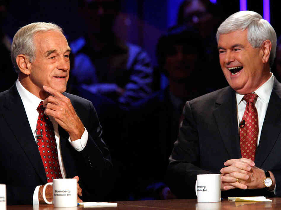 Republican presidential candidates Ron Paul and Newt Gingrich laugh at a presidential debate at Dartmouth College in Hanover, N.H., in October. 