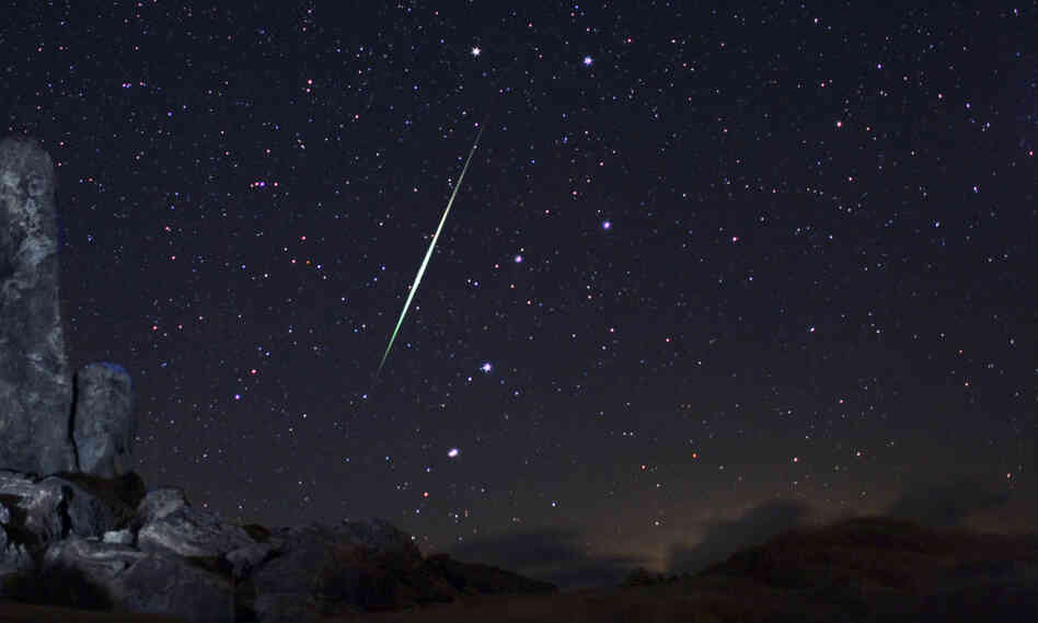 In this picture provided by Wally Pacholka of AstroPics.com, a Geminid fireball explodes over the Mojave Desert in the Jojave Desert, Calif. on Dec. 13, 2009.
