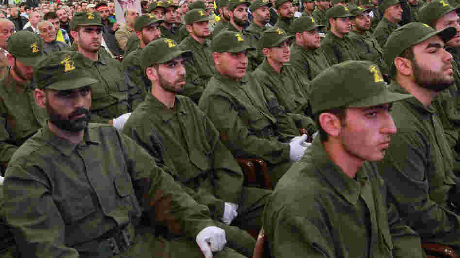 Hezbollah members listen to a speech by the group's leader, Â Hassan Nasrallah, via video-link in the southern suburbs of Beirut on Nov. 11, 2011.
