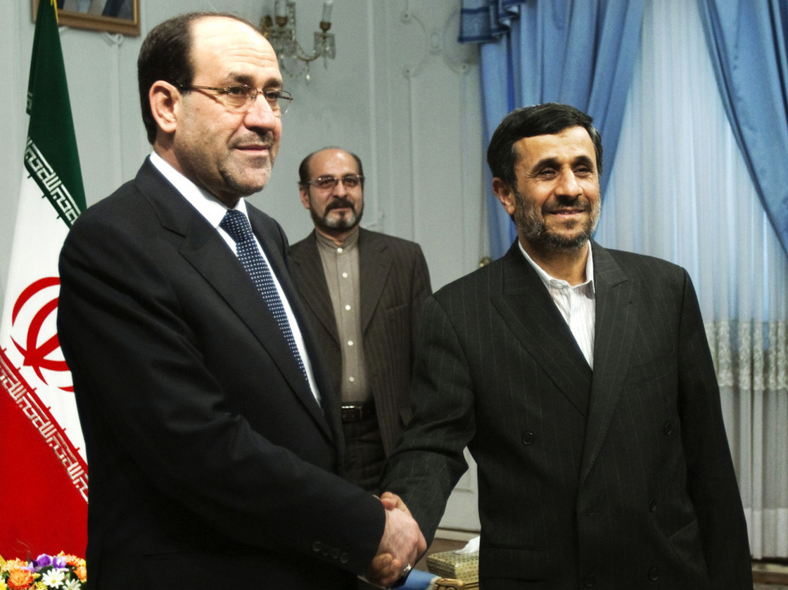 Iraqi Prime Minister Nouri al-Maliki (left) shakes hands with Iran's President Mahmoud Ahmadinejad during an official meeting in Tehran last year. 