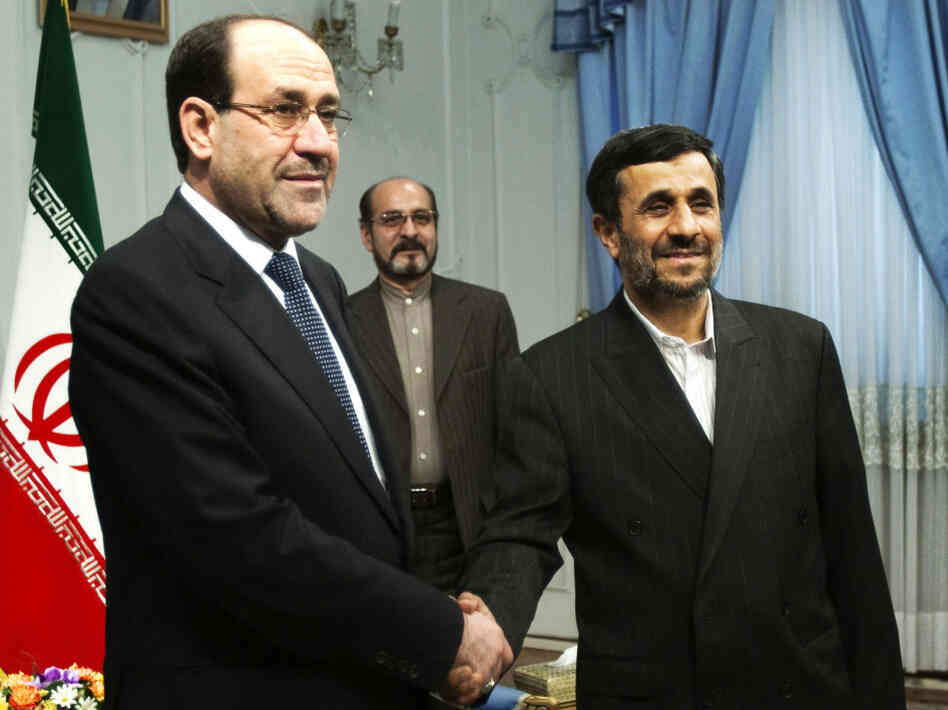 Iraqi Prime Minister Nouri al-Maliki (left) shakes hands with Iran's President Mahmoud Ahmadinejad during an official meeting in Tehran last year. 