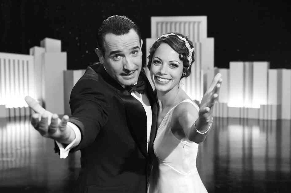 Jean Dujardin (left) and Berenice Bejo in The Artist. Critics in New York selected The Artist as the best picture. 