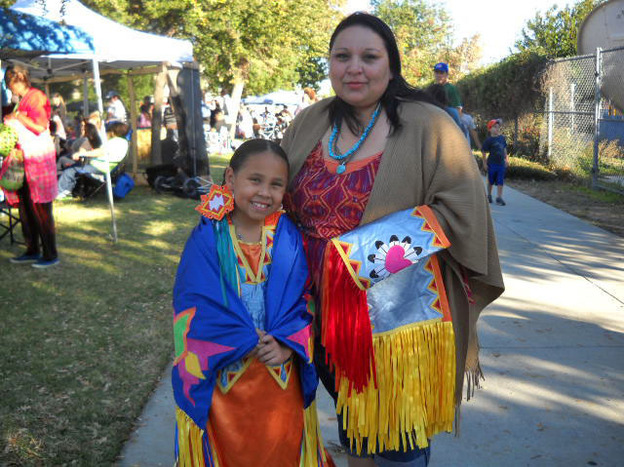 Serenity Wyatt, 8, and her mother, April Duenas, attend the 28th annual powwow held by California State University, Northridge. 
