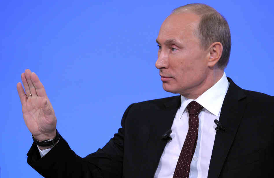 Russia's Prime Minister Vladimir Putin gestures during his annual phone-in session with Russians in Moscow.