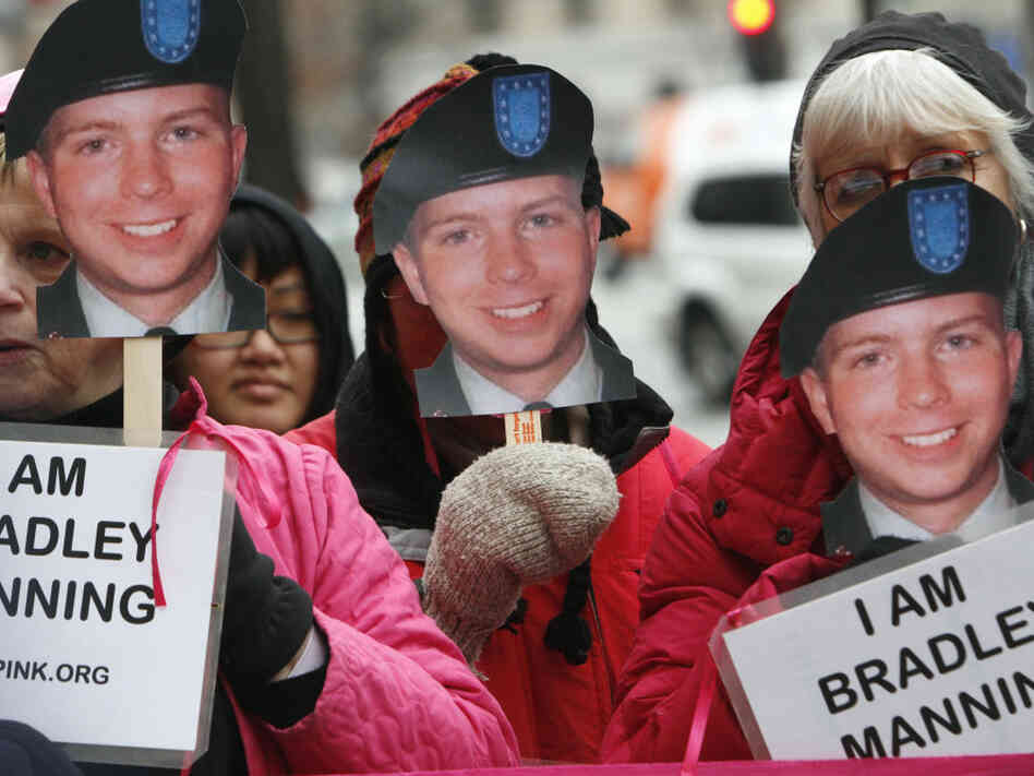 CodePink activists hold signs last January in support of U.S. Army Pfc. Bradley Manning, the alleged leaker of documents to WikiLeaks. Manning will appear in court for the first time Friday.