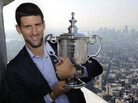 Novak Djokovic smiles with his U.S. Open trophy atop the Empire State Building in New York, Sept. 13, 2011. The Serbian defeated Rafael Nadal to win his first U.S. Open tennis championship and third Grand Slam trophy of 2011. Novak Djokovic smiles with his U.S. Open trophy atop the Empire State Building in New York, Sept. 13, 2011. The Serbian defeated Rafael Nadal to win his first U.S. Open tennis championship and third Grand Slam trophy of 2011.
