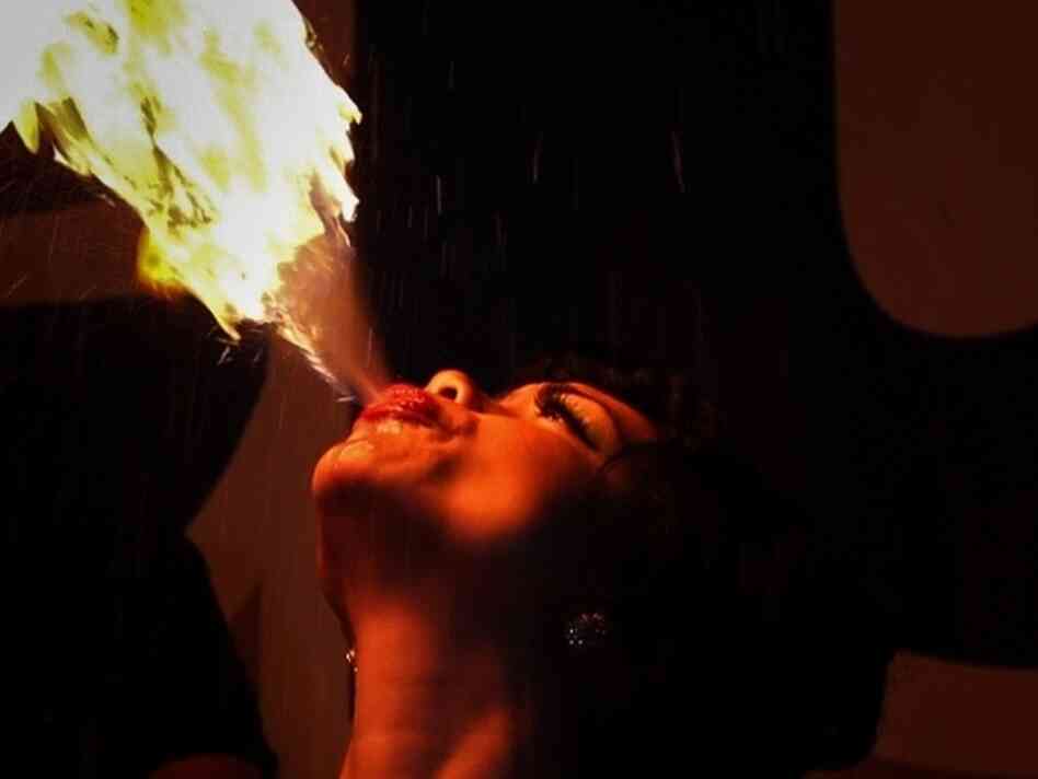 A woman breathing fire
