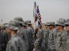 The American flag, Iraqi flag, and the U.S. Forces Iraq colors are carried during ceremonies in Baghdad today marking the end of the U.S. military mission in Iraq. The American flag, Iraqi flag, and the U.S. Forces Iraq colors are carried during ceremonies in Baghdad today marking the end of the U.S. military mission in Iraq.