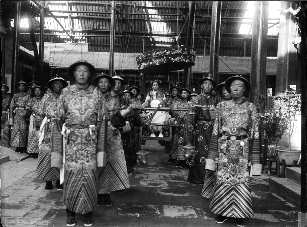 Cixi sits in a sedan chair, surrounded by eunuchs, circa 1903-04. Rumor has it that Cixi bribed the eunuchs to get better access to the emperor. Out of dozens of concubines, Cixi was the only one to bear a child.