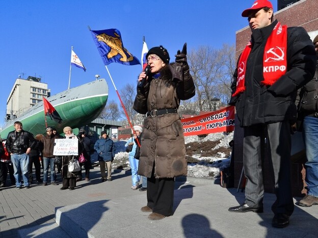 Activists protest on Dec. 10 in Vladivostock against the alleged mass fraud in the Dec. 4 parliamentary polls.