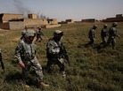 Gen. David Petraeus (center, with no gun) walks with troops in 2007 in Baqouba, Iraq. The area had recently been seized back from al-Qaida control with help from U.S. forces who were part of the surge. The surge is widely credited with changing the course of the war; now, some experts are debating how much credit it deserves. Gen. David Petraeus (center, with no gun) walks with troops in 2007 in Baqouba, Iraq. The area had recently been seized back from al-Qaida control with help from U.S. forces who were part of the surge. The surge is widely credited with changing the course of the war; now, some experts are debating how much credit it deserves.