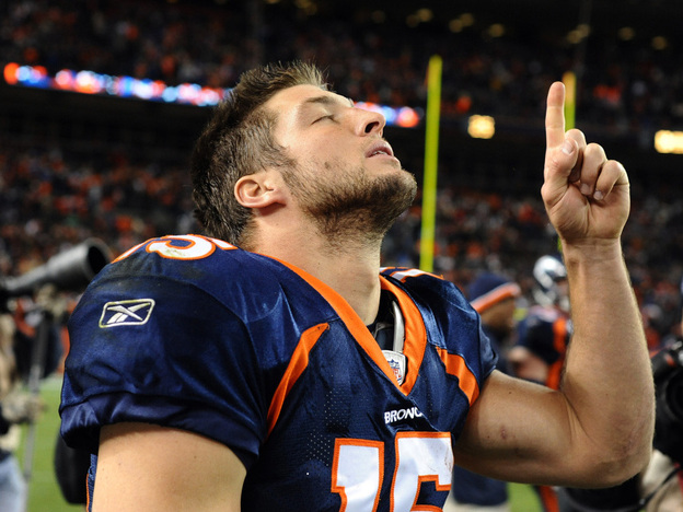  Tebow celebrates after the game against the New York Jets on Nov. 17, 2011 in Denver. 