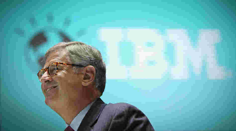 Reason To Smile: Samuel Palmisano, president and CEO of IBM, walks by an IBM logo at the CeBIT technology fair in Hanover, Germany. Palmisano is set to step down later this month, and Virginia Rometty will take over on Jan. 1.