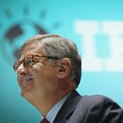 Reason To Smile: Samuel Palmisano, president and CEO of IBM, walks by an IBM logo at the CeBIT technology fair in Hanover, Germany. Palmisano is set to step down later this month, and Virginia Rometty will take over on Jan. 1.