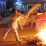 Family members burn funeral offerings for Xue Jinbo on Friday. Xue, 42, was involved in a property dispute that turned into a major confrontation with authorities in the southern Chinese village of Wukan. He died in police custody. 