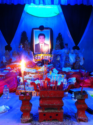 An altar in honor of Xue. Residents in his home village of Wukan believe he was detained and beaten by police for the role he played as a negotiator in a land dispute with the local government. An altar in honor of Xue. Residents in his home village of Wukan believe he was detained and beaten by police for the role he played as a negotiator in a land dispute with the local government.