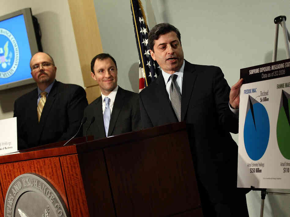 Robert Khuzami (right), director of the U.S. Securities and Exchange Commission's Enforcement Division, announces that the SEC is charging six former top executives of Fannie Mae and Freddie Mac with securities fraud on Friday.
