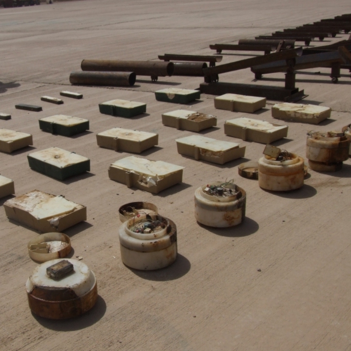 U.S. and Iraqi soldiers display "sticky IEDs"  — magnetic bombs that militants attach to vehicles — found during a raid at a checkpoint near the Iraq-Iran border.