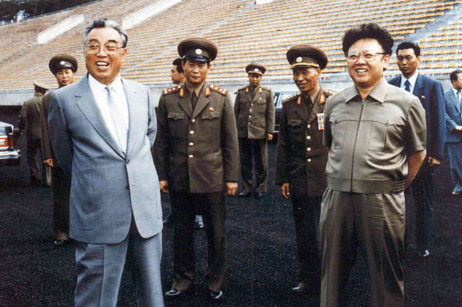 1992: Kim Jong Il (right) and his father and then-leader Kim Il Sung (left) inspect a soccer ground in Pyongyang. Kim Jong Il was named general secretary of the ruling Workers' Party, one of two top posts left vacant since the death of the elder Kim in 1994. 