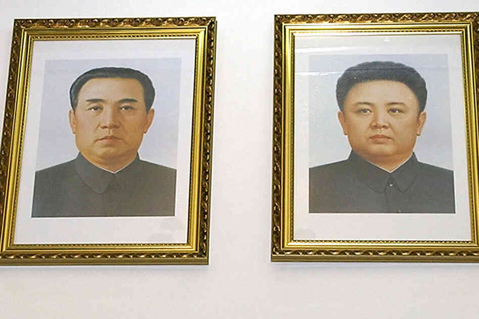 Feb. 28, 2004: Portraits of Kim Il Sung (left) and Kim Jong Il hang on the wall at the North Korean embassy in Beijing. 
