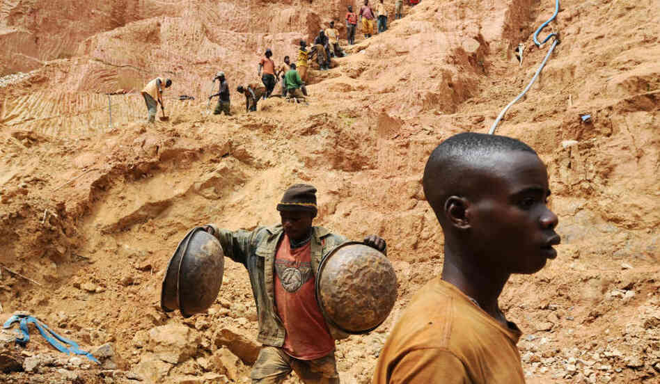 Workers dig at a mine in Chudja, near Bunia, north eastern Congo. The conflict in the Congo, a nation rich in mineral resources such as gold, diamonds, tin, and cobalt, has often been linked to a struggle for control over its minerals resources. 