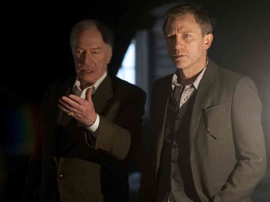 Henrik Vanger (Christopher Plummer, left) offers Mikael Blomkvist (Daniel Craig) a big paycheck to crack the mystery of his missing granddaughter. 